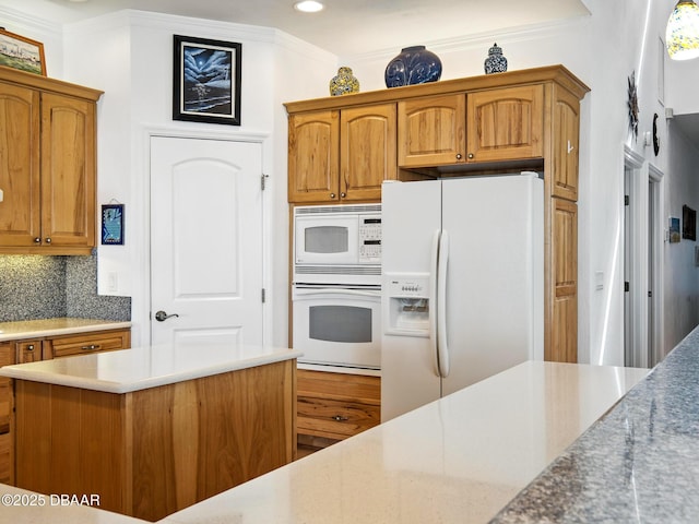 206 S Riverside Dr, Edgewater, FL 32132 - kitchen featuring white appliances, backsplash, ornamental molding, recessed lighting, and brown cabinets