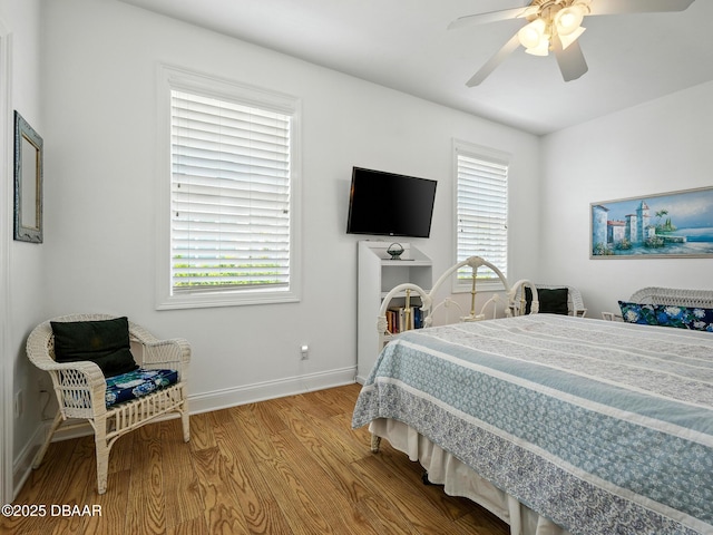 206 S Riverside Dr, Edgewater, FL 32132 - bedroom with wood finished floors, multiple windows, and ceiling fan