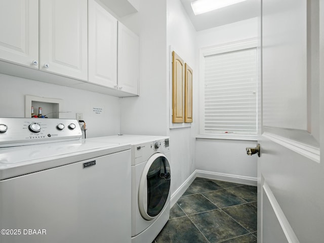 206 S Riverside Dr, Edgewater, FL 32132 - laundry room featuring washer and clothes dryer, cabinet space, and dark stone finish flooring