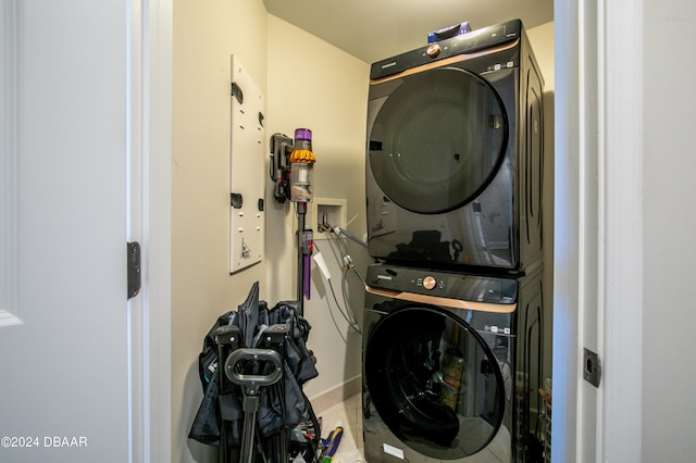 laundry room with stacked washer and dryer