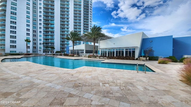 view of pool featuring a patio area