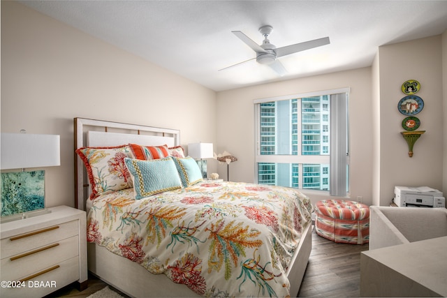 bedroom featuring ceiling fan and dark hardwood / wood-style floors