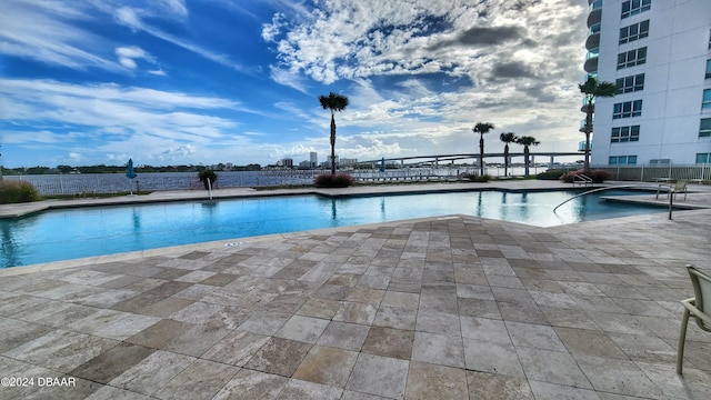 view of swimming pool with a patio