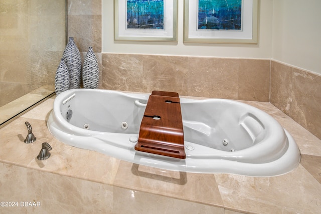 bathroom featuring tiled bath