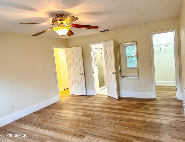 spacious closet featuring hardwood / wood-style flooring