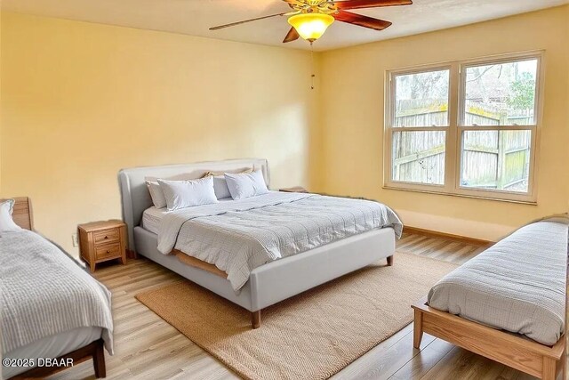 unfurnished bedroom with ceiling fan, light hardwood / wood-style floors, and a closet