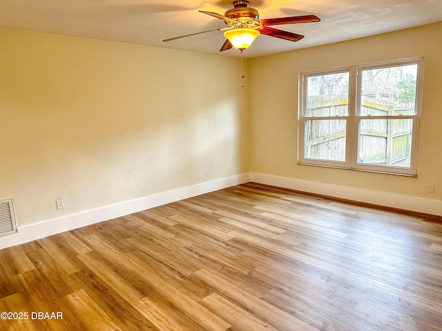 spare room with ceiling fan and light hardwood / wood-style flooring