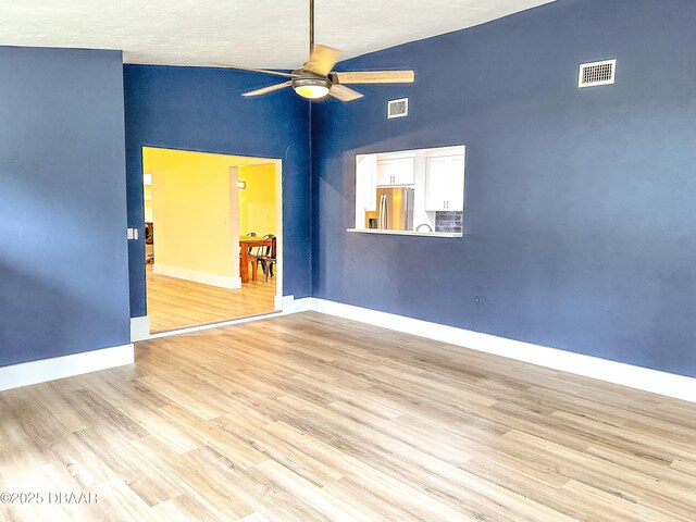 unfurnished sunroom featuring ceiling fan and lofted ceiling