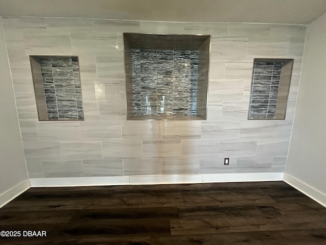 room details featuring baseboards and wood finished floors