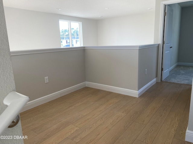 spare room featuring light hardwood / wood-style flooring