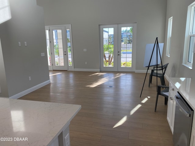 living room with hardwood / wood-style flooring and french doors