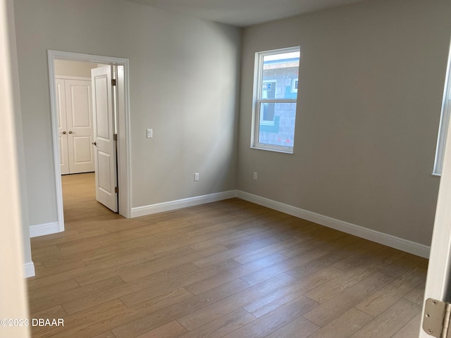 unfurnished room featuring light wood-type flooring