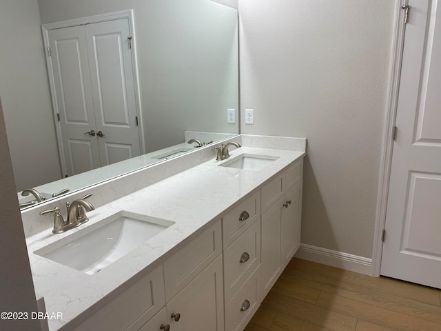 bathroom featuring hardwood / wood-style floors and vanity