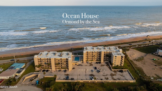 aerial view featuring a view of the beach and a water view