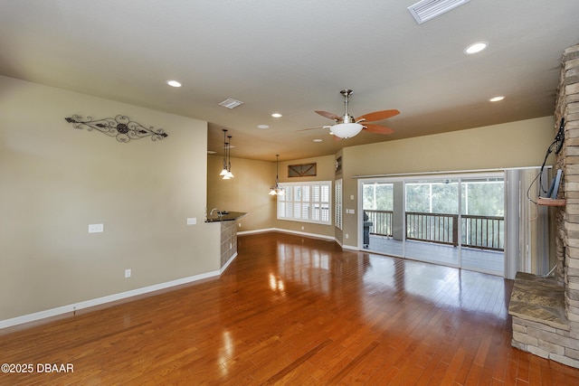 6065 Spruce Point Cir, Port Orange, FL 32128 - unfurnished living room featuring ceiling fan, hardwood / wood-style floors, and recessed lighting