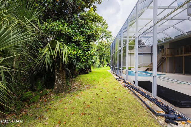 6065 Spruce Point Cir, Port Orange, FL 32128 - view of grassy yard featuring an outdoor pool, glass enclosure, and a patio