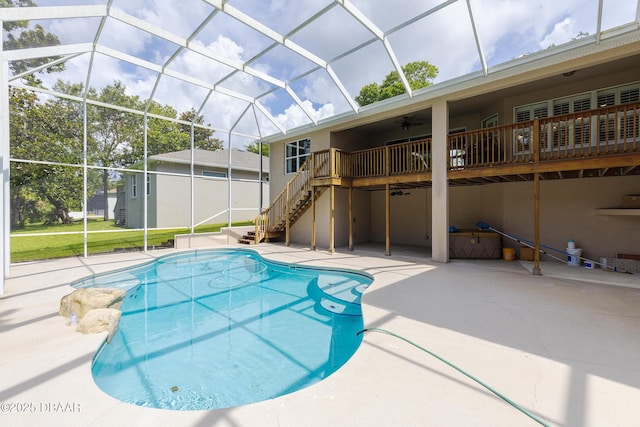 6065 Spruce Point Cir, Port Orange, FL 32128 - swimming pool featuring stairway, a patio area, a ceiling fan, and a lanai