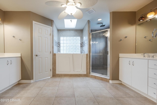 6065 Spruce Point Cir, Port Orange, FL 32128 - full bath with a ceiling fan, a shower stall, vanity, tile patterned flooring, and recessed lighting