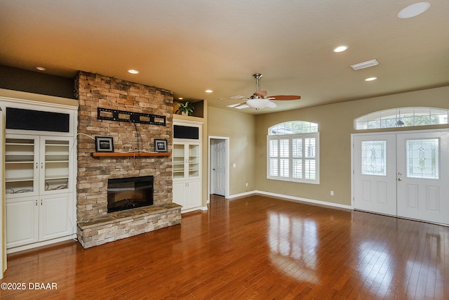 6065 Spruce Point Cir, Port Orange, FL 32128 - unfurnished living room featuring a stone fireplace, wood finished floors, a ceiling fan, and recessed lighting