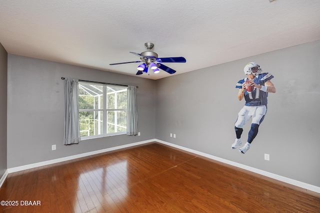 6065 Spruce Point Cir, Port Orange, FL 32128 - empty room with wood-type flooring, a ceiling fan, and a textured ceiling