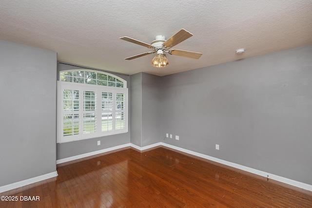 6065 Spruce Point Cir, Port Orange, FL 32128 - spare room with wood-type flooring, a smoke detector, ceiling fan, and a textured ceiling