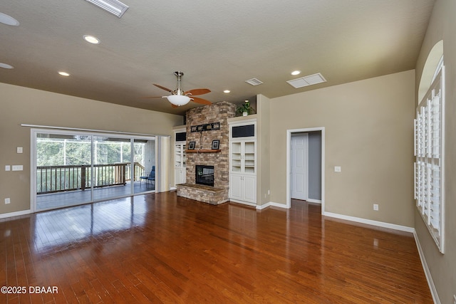 6065 Spruce Point Cir, Port Orange, FL 32128 - unfurnished living room with a ceiling fan, wood finished floors, a stone fireplace, and recessed lighting