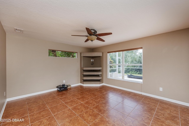 6065 Spruce Point Cir, Port Orange, FL 32128 - spare room featuring tile patterned floors and a ceiling fan