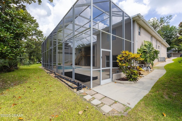 6065 Spruce Point Cir, Port Orange, FL 32128 - back of property with a lanai, a lawn, a patio, stucco siding, and an outdoor pool