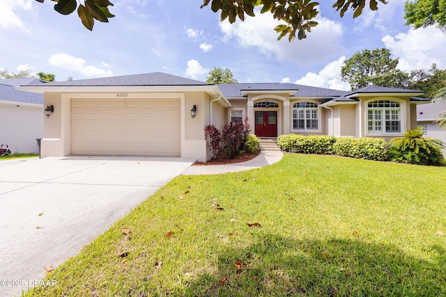6065 Spruce Point Cir, Port Orange, FL 32128 - single story home with french doors, stucco siding, an attached garage, and driveway