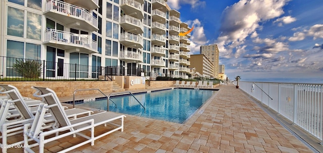 view of swimming pool featuring a patio