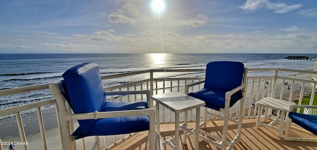 balcony with a beach view and a water view