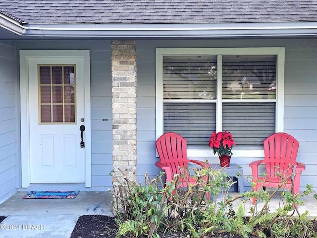 doorway to property featuring a porch