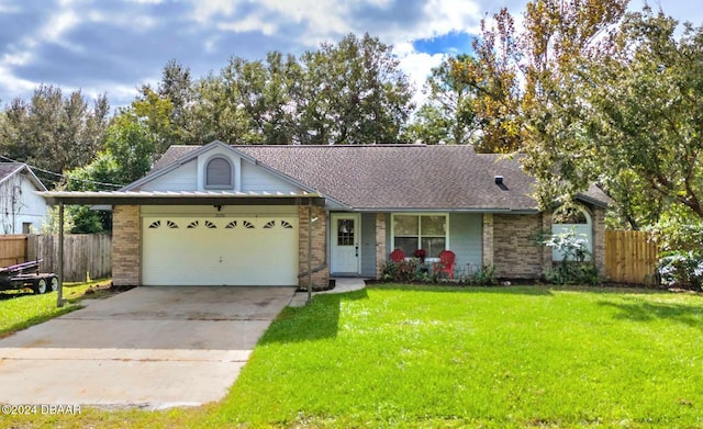 ranch-style house featuring a garage and a front lawn