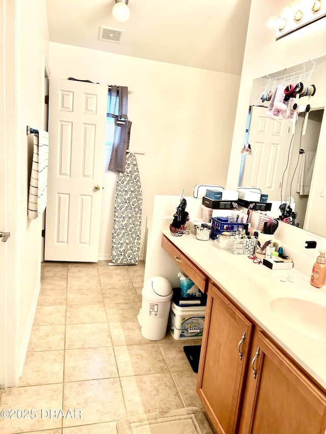 full bath featuring visible vents, vanity, and tile patterned floors