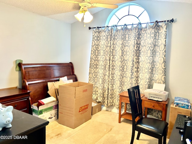 office space with a ceiling fan, lofted ceiling, light carpet, and a textured ceiling