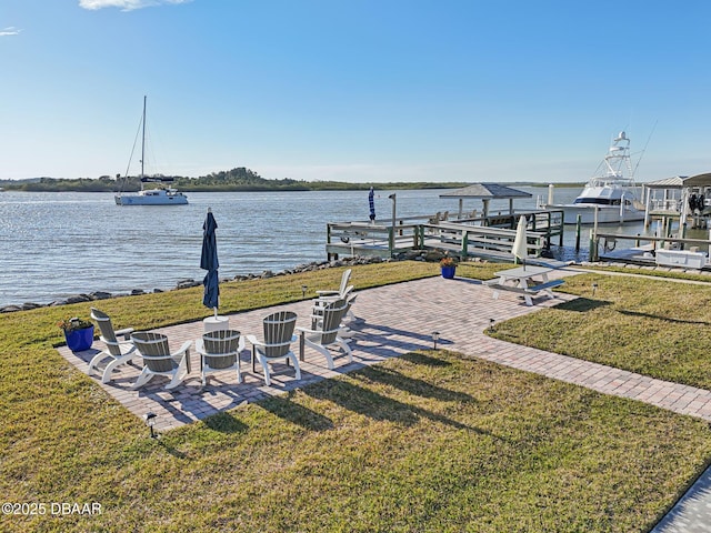 view of yard featuring a boat dock and a water view