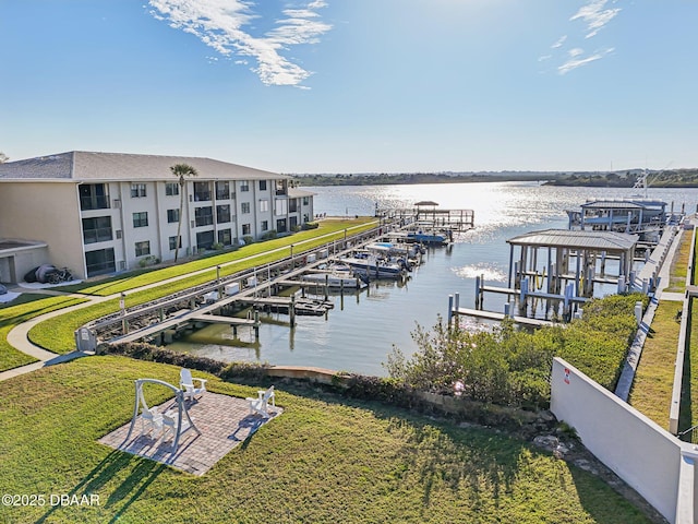 view of dock featuring a yard and a water view