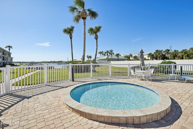 view of swimming pool featuring a patio area