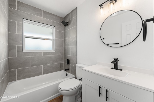 bathroom with toilet, bathing tub / shower combination, and vanity