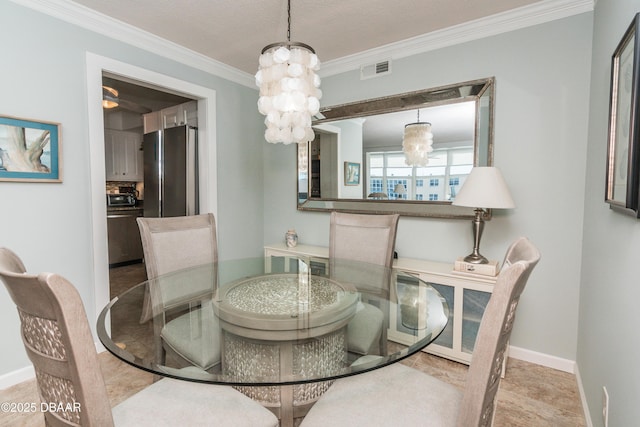 dining room with a notable chandelier and ornamental molding