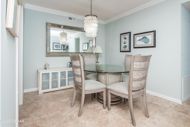 tiled dining space featuring ornamental molding and an inviting chandelier