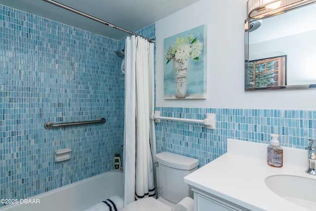 full bathroom featuring vanity, toilet, shower / bathtub combination with curtain, and tile walls