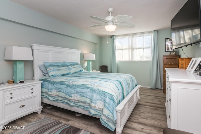 bedroom with ceiling fan and light hardwood / wood-style floors