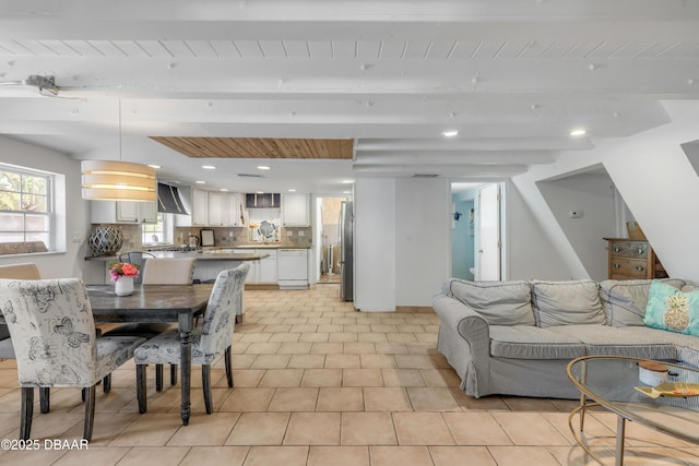 living room featuring beamed ceiling and wood ceiling