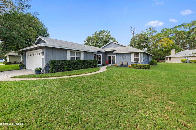 ranch-style house with a garage and a front yard