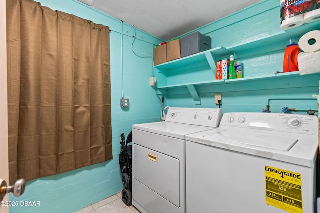 1 Beechwood Dr, Ormond Beach, FL 32176 - laundry area with independent washer and dryer, light tile patterned floors, and concrete block wall