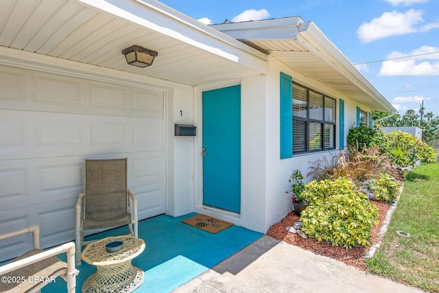 1 Beechwood Dr, Ormond Beach, FL 32176 - property entrance with concrete block siding and a garage
