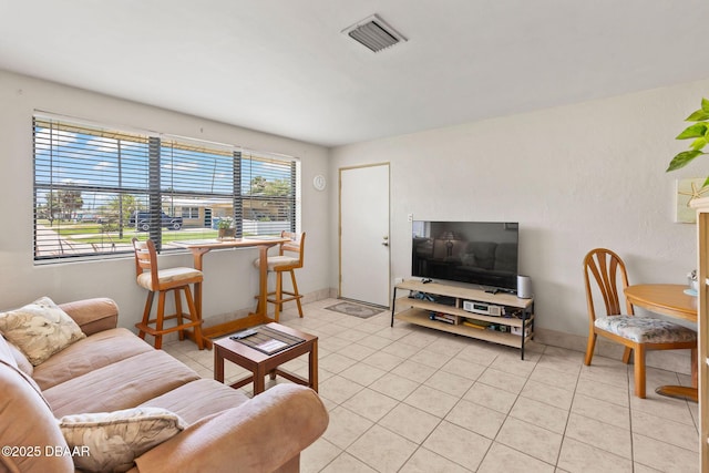 1 Beechwood Dr, Ormond Beach, FL 32176 - living room featuring light tile patterned flooring and baseboards