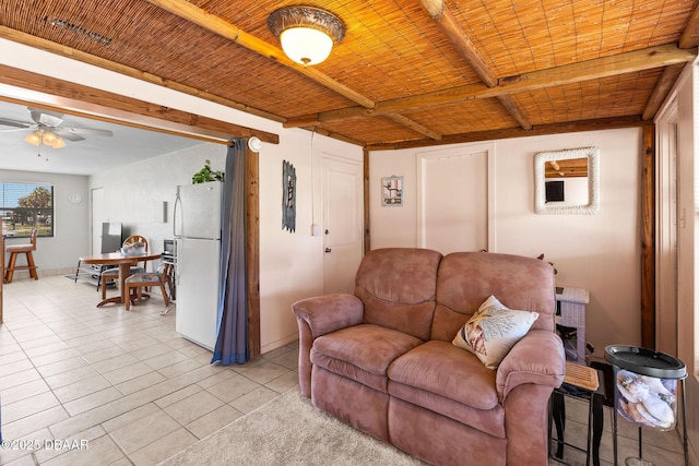 1 Beechwood Dr, Ormond Beach, FL 32176 - living area with ceiling fan, light tile patterned flooring, and a wooden ceiling with exposed beams