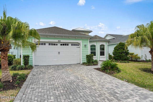 ranch-style house featuring a garage